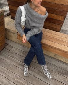 woman wearing sweater and jeans