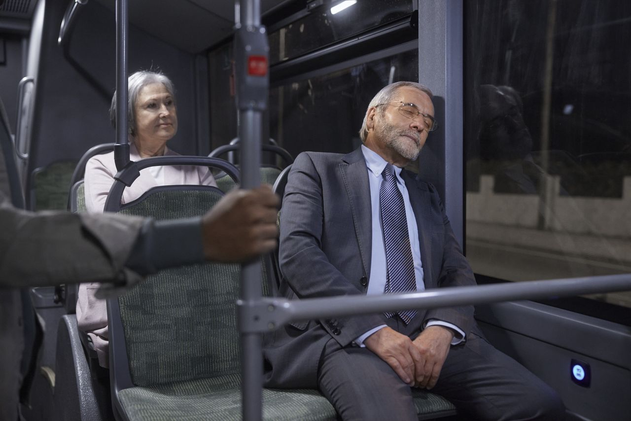 Asleep on a bus.