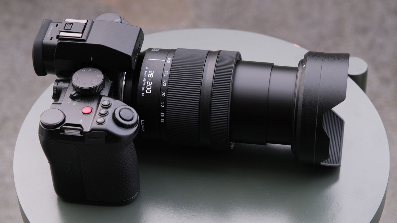 Panasonic Lumix S 28-200mm lens on a green table attached to a camera