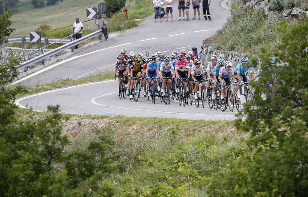 The peloton climbs during stage 20