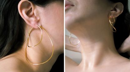 Woman wearing simple gold oversized hoops 