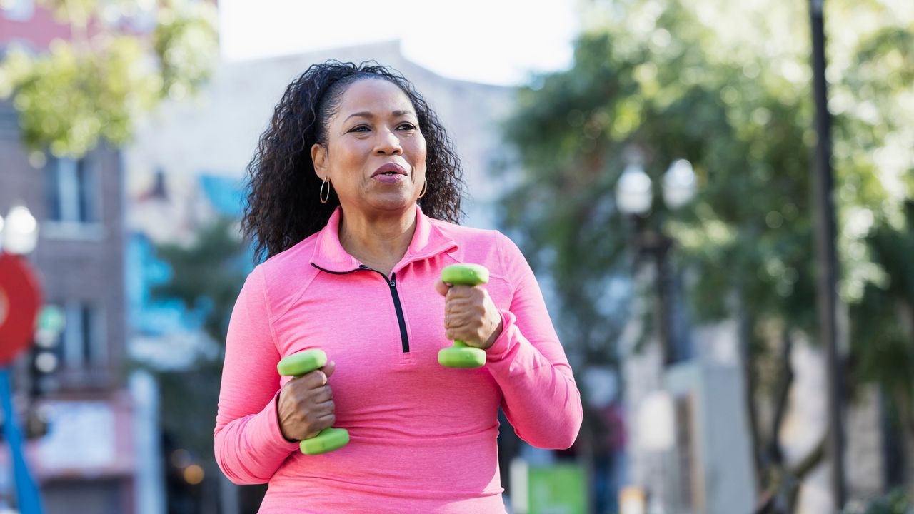 woman exercising with dumbbells