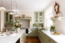 cottage lighting ideas olga house liam clarke green kitchen with white pendant lights