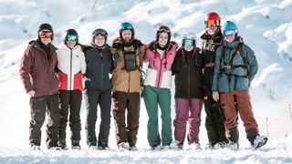 A group of skiers wearing Helly Hansen