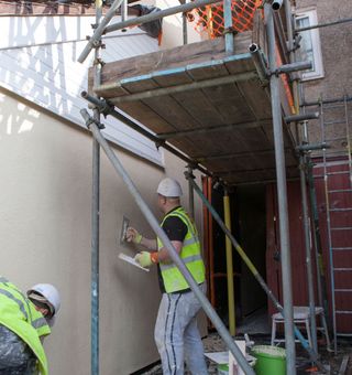 workers paining with painting tool