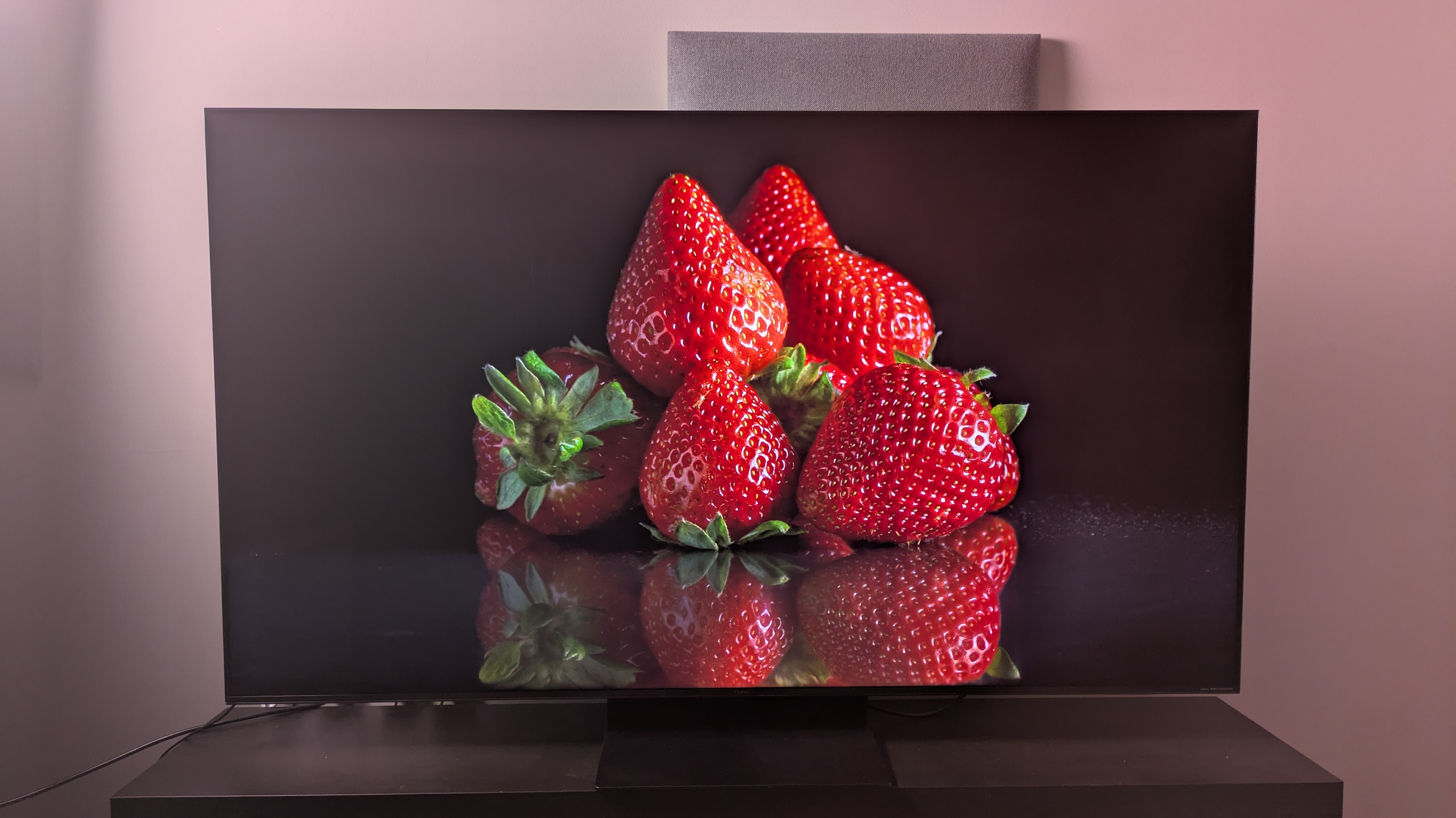 TCL C7K displaying strawberries on screen