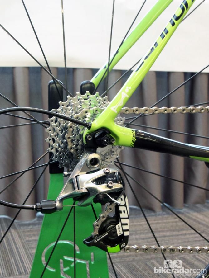 The internally routed rear derailleur cable exits right at the dropout. You can just barely see a bit of exposed cable above the quick-release nut