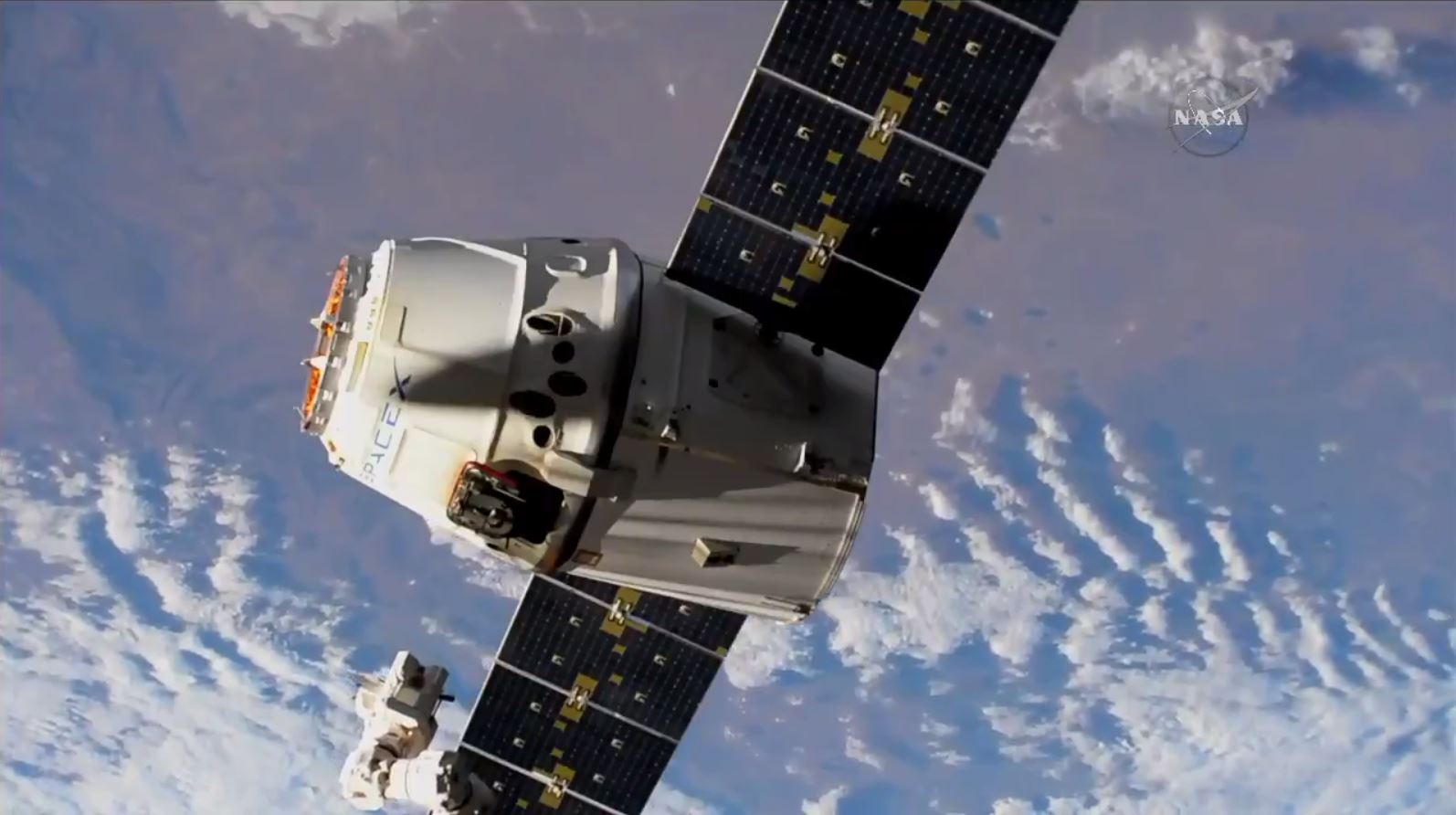 A reused Dragon cargo spacecraft was release from the International Space Station today (July 3) for a return trip to Earth.