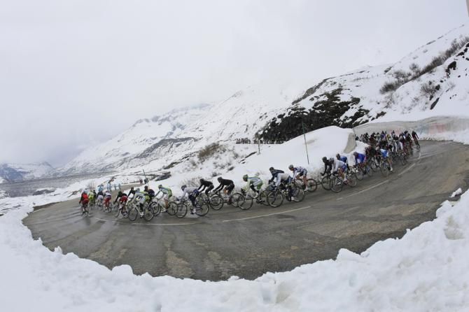 The peloton descends the first climb