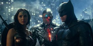 Justice League Wonder Woman, Cyborg, and Batman standing together on a rooftop