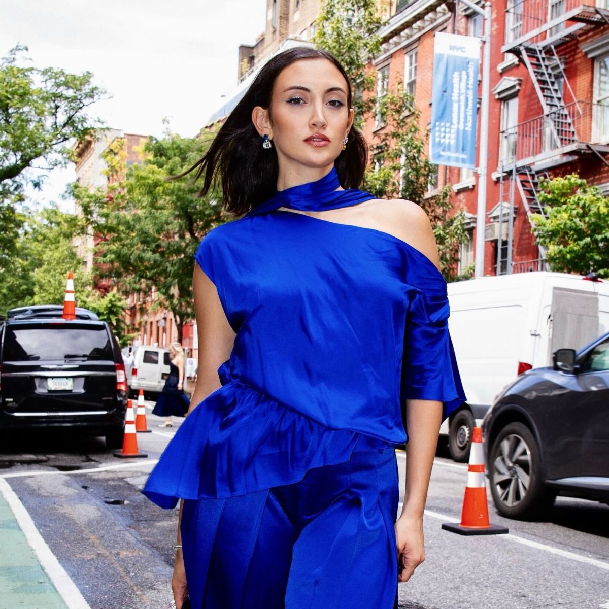 An image of Who What Wear associate beauty editor Alyssa Brascia wearing a blue Alice and Olivia set, shot by photographer Hana Adams.