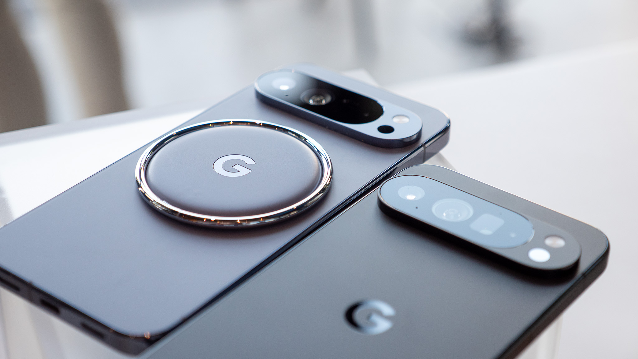 A Google Pixelsnap ring attached to the back of the Google Pixel 10 Pro XL via Qi2 magnets