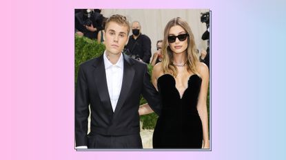  Justin Beiber and Hailey Bieber pose on the red carpet together as they attend The 2021 Met Gala Celebrating In America: A Lexicon Of Fashion at Metropolitan Museum of Art on September 13, 2021 in New York City. on a pink, blue and purple gradient background