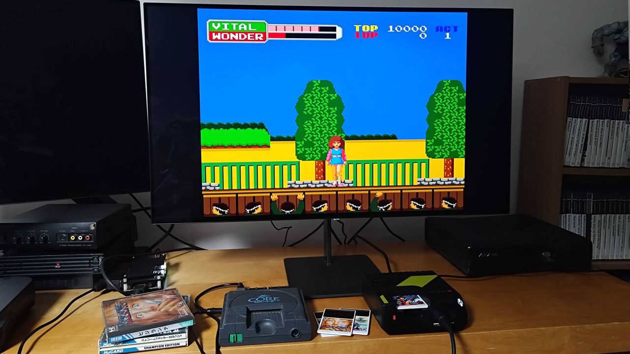Hyperkin Retron GX running Wonder Momo next to PC Engine under monitor.
