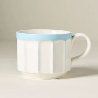 Blue and white mug with scalloped design 