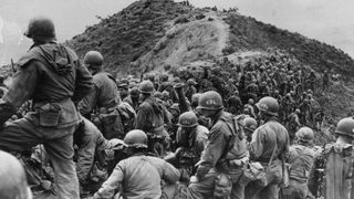 Men of the 187th US Regimental Combat Team prepare for battle during the Korean War