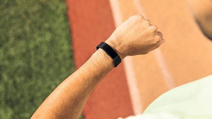 Runner wearing Fitbit Inspire HR tracker