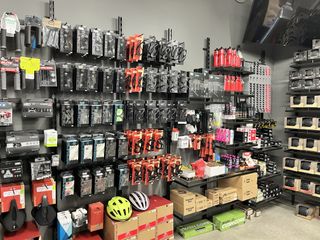A wall of cycling products from the bike shop within the Specialized HQ