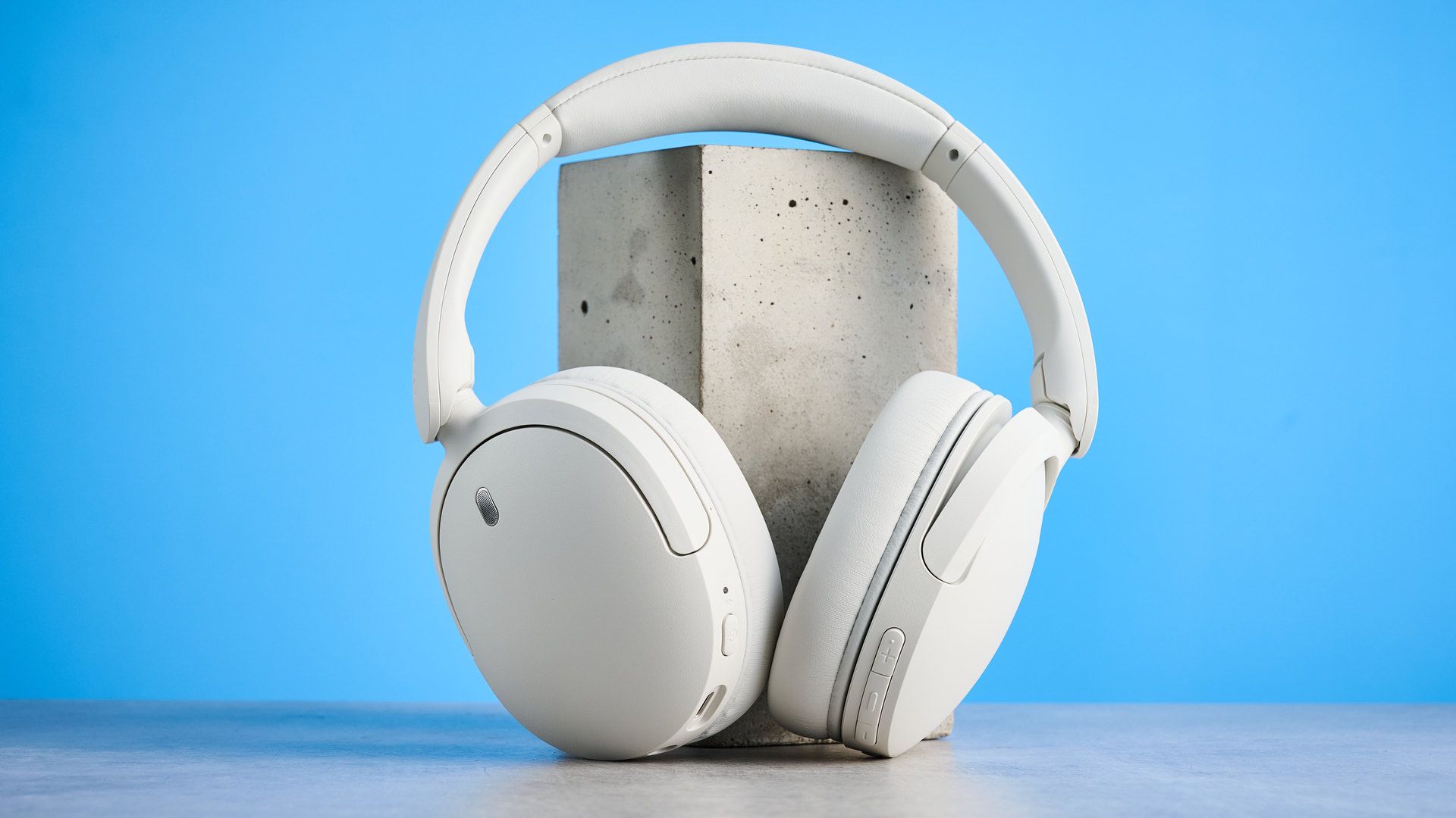Sony WH-CH730N in white photographed in front of a blue background