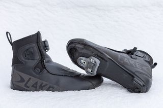 A pair of Lake 146 cycling boots in the snow