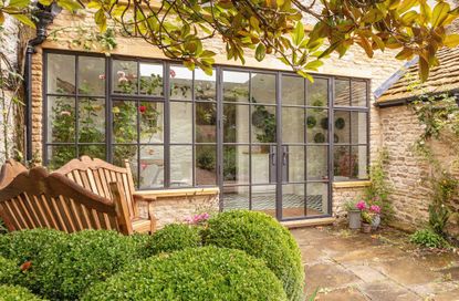 patio doors in a cotswold stone conservatory