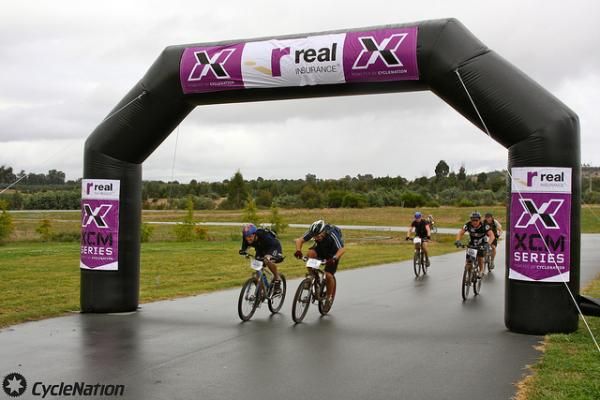 Racers cross the finish line.