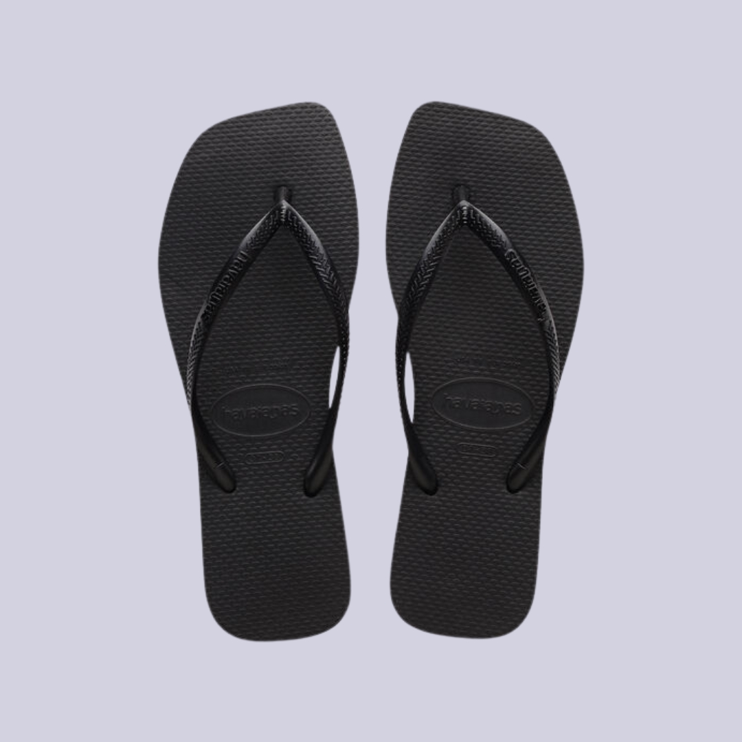 Havaianas Slim Square flipflops in black against lilac background.