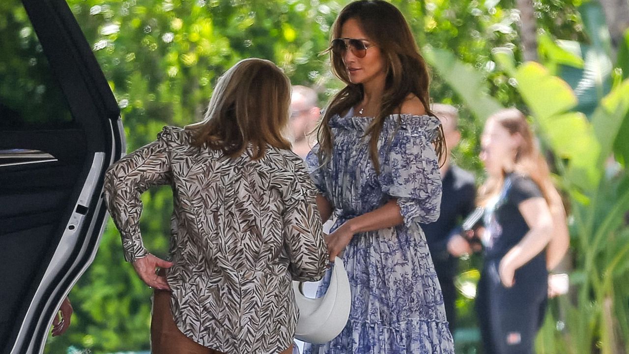 Jennifer Lopez spotted in Los Angeles wearing a floral dress and Charles &amp; Keith Bag