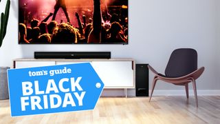 The TCL Alto 5+ Soundbar in a living room with a Black Friday sticker.