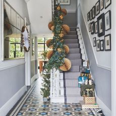 Hallway with christmas decorations up the bannister