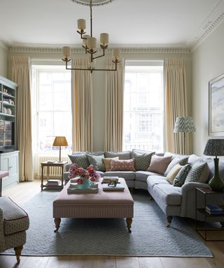 living room with cream walls and gray sofas and patterned cushions in Edinburgh Georgian townhouse designed by Jessica Buckley