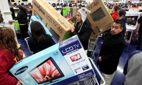 Customers shop for electronics at a Best Buy in San Diego on &amp;quot;Black Friday&amp;quot; last year.