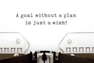 A goal without a plan is just a wish! quote printed on an old typewriter.