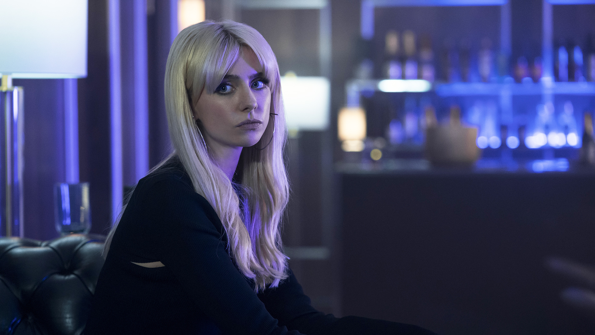 A seated Cate staring at an off-camera Cipher in gen V season 2 episode 5