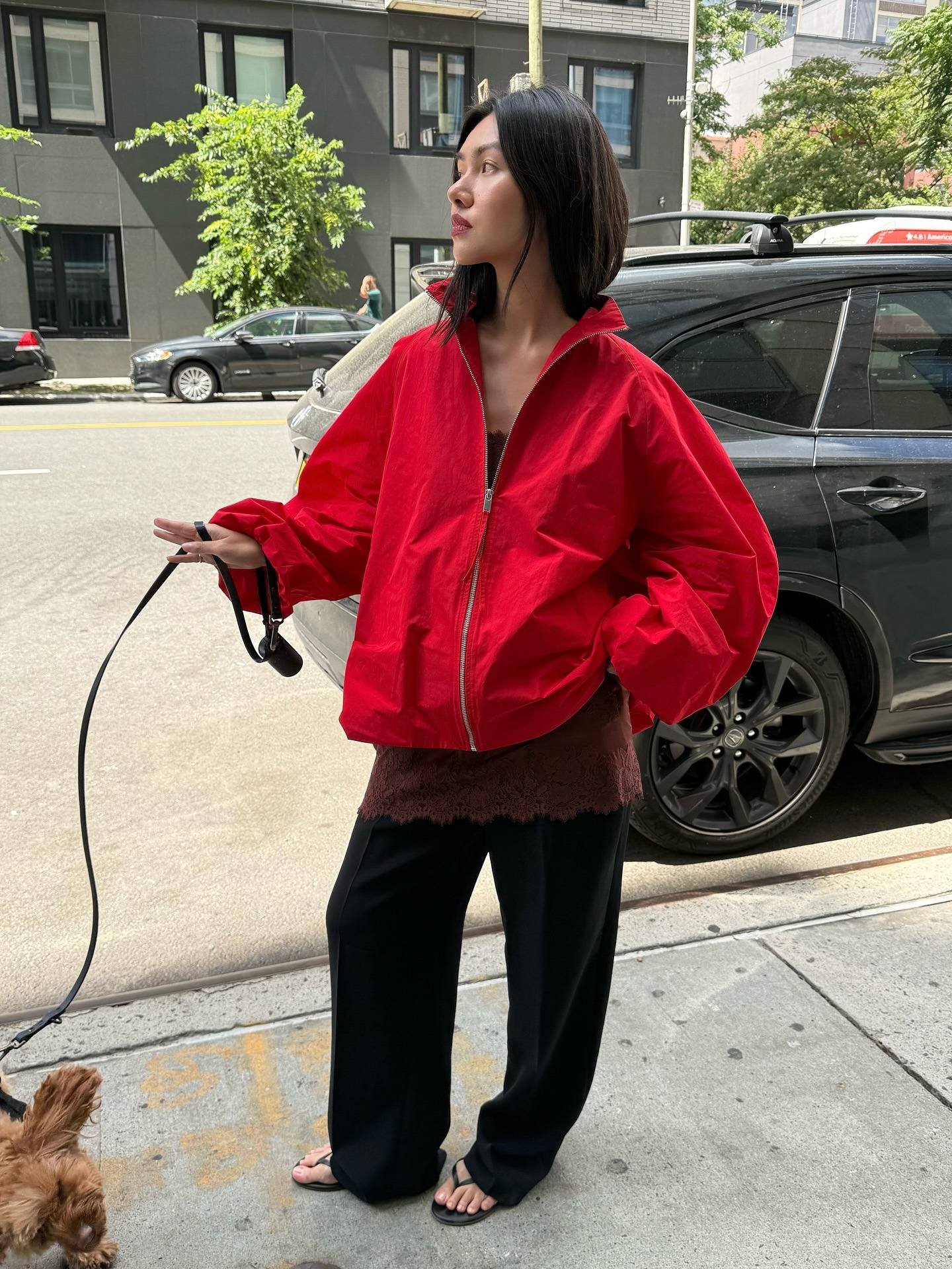 A woman wearing a transitional weather outfit.