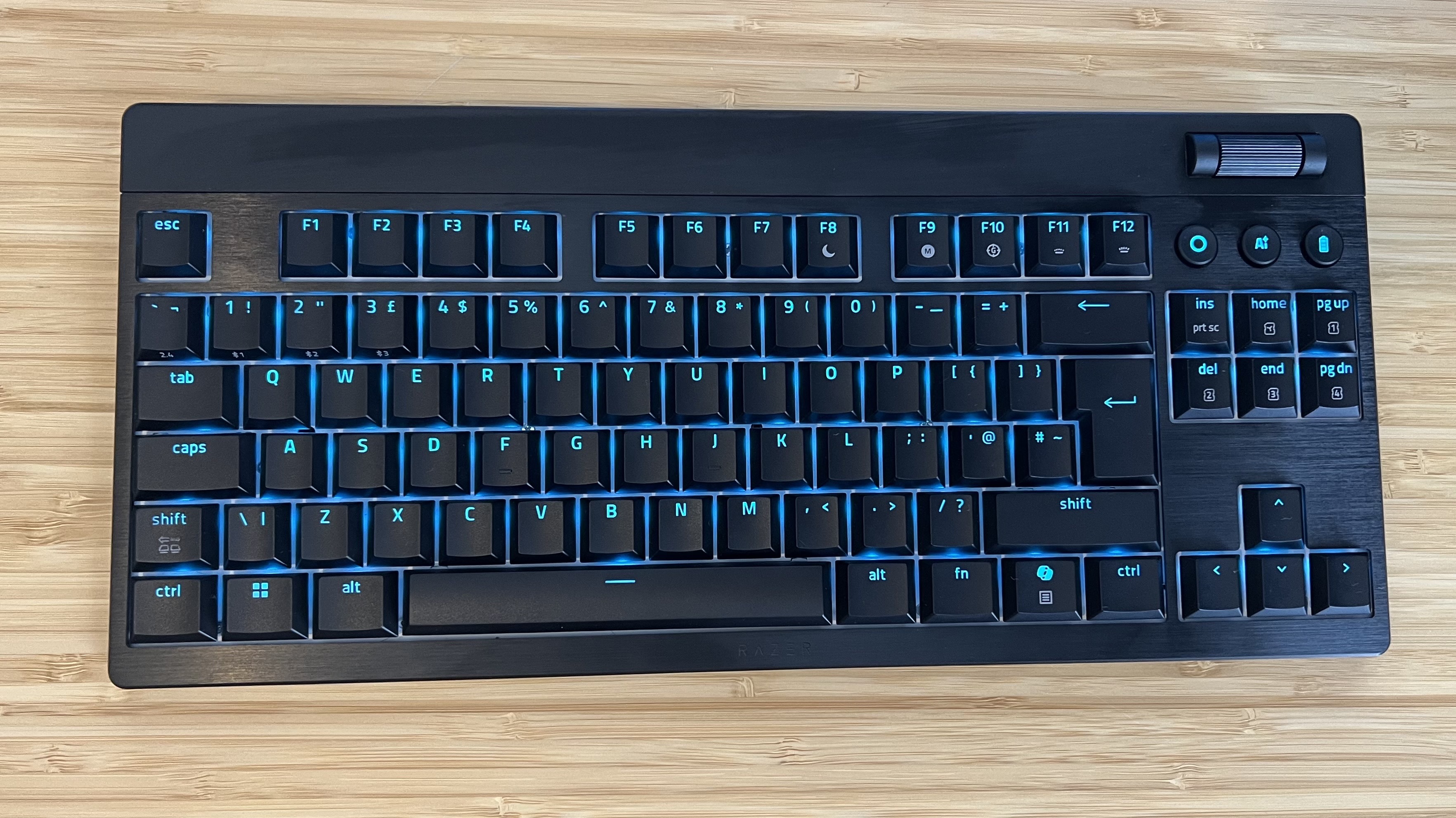 Razer Blackwidow V4 Low Profile gaming keyboard on a wooden desk