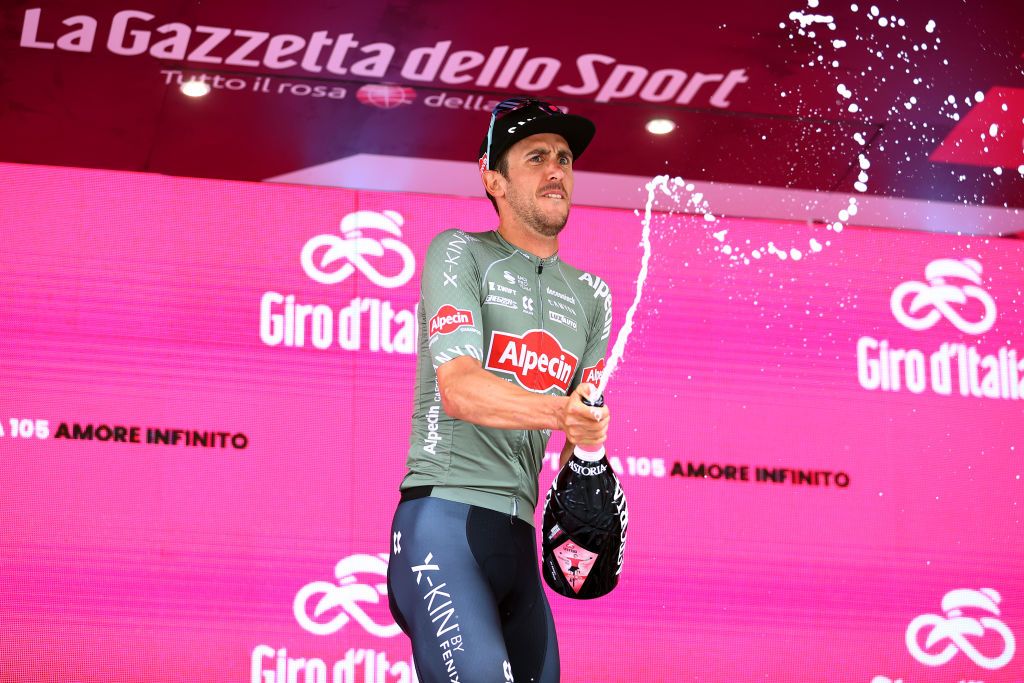 TREVISO ITALY MAY 26 Dries De Bondt of Belgium and Team Alpecin Fenix celebrates winning the stage on the podium ceremony after the 105th Giro dItalia 2022 Stage 18 a 156km stage from Borgo Valsugana to Treviso Giro WorldTour on May 26 2022 in Treviso Italy Photo by Michael SteeleGetty Images