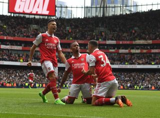 Gabriel Jesus celebrates scoring the 2nd Arsenal goal with (L) Gabriel Martinelli and (R) Granit Xhaka during the Premier League match between Arsenal FC and Tottenham Hotspur at Emirates Stadium on October 01, 2022 in London, England.