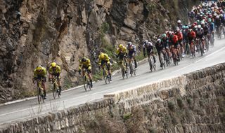 The pack of riders cycles during the 7th stage of the Paris-Nice cycling race, 109,3 km between Nice and Auron, on March 15, 2025. (Photo by Anne-Christine POUJOULAT / AFP)