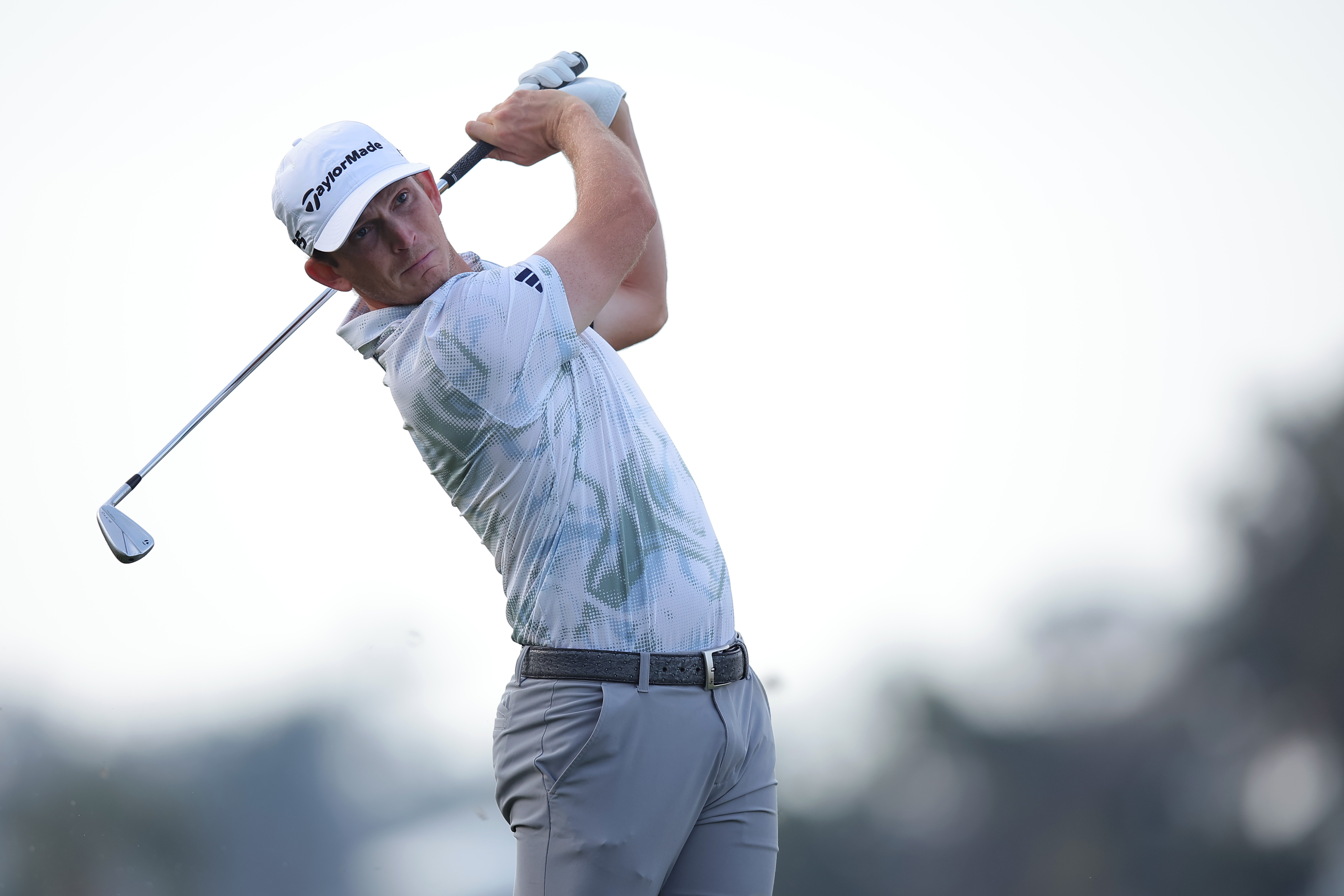 Jacob Bridgeman hits an iron 