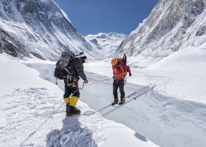 Mountaineers crossing icefall