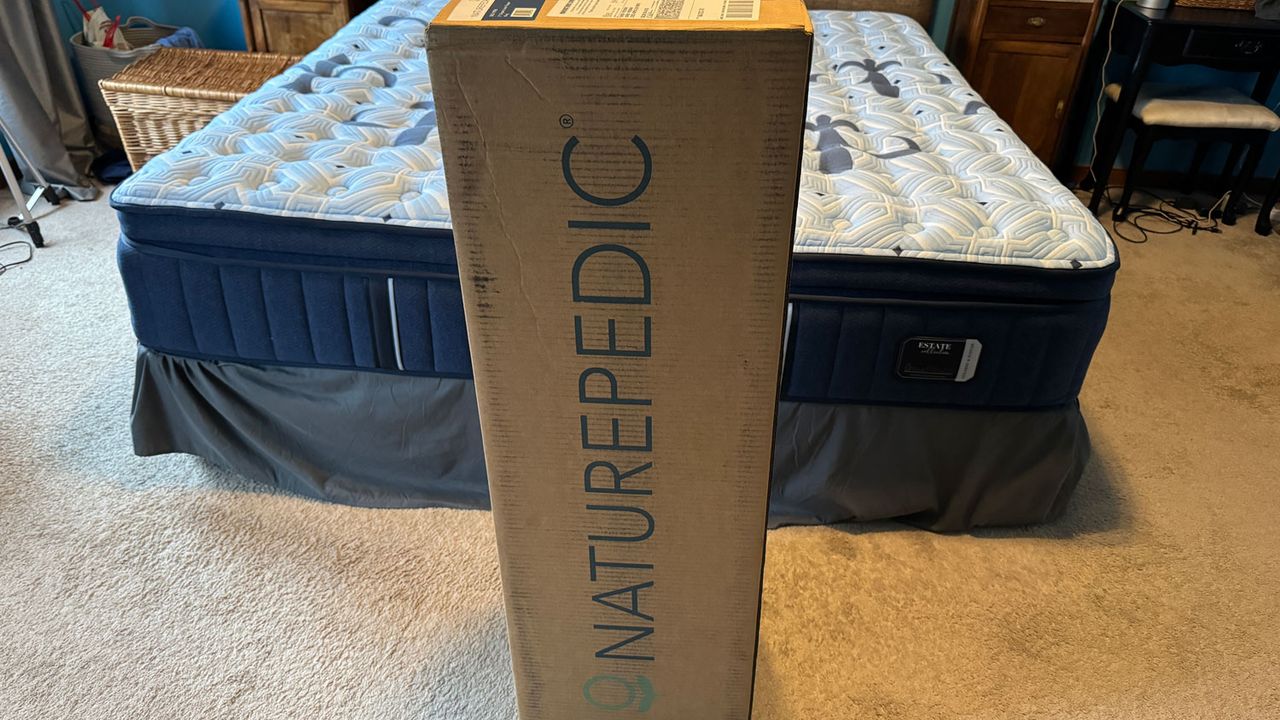 The Naturepedic Adagio 2" Organic Latex Mattress Topper in its delivery box