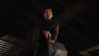 Tony Stark trying to lift Thor's hammer