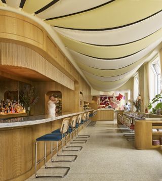 bar interior with canopied yellow and white striped ceiling