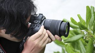 Photographer capturing closeups of plants with Canon RF 28-70mm F2.8 IS STM lens