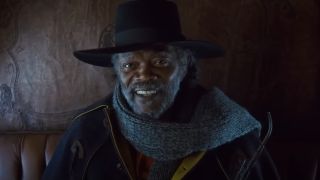 Samuel L Jackson sits smiling in a stagecoach in The Hateful Eight.