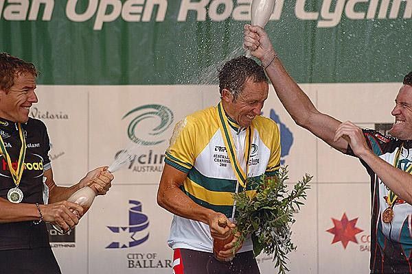 Matthew Lloyd is showered with champers by