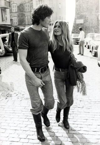 Brigitte Bardot and a guy walking