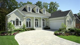 Exterior of an American house with white brick driveway