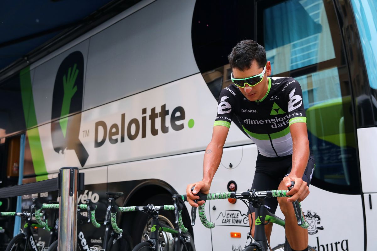 Lachlan Morton warms up outside the Dimension Data team bus